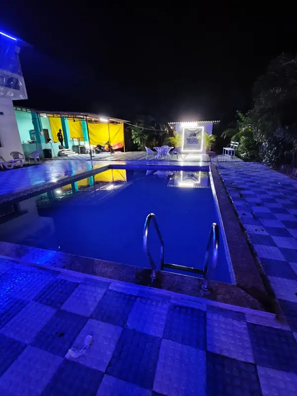 The pool and ladder lit up at night
